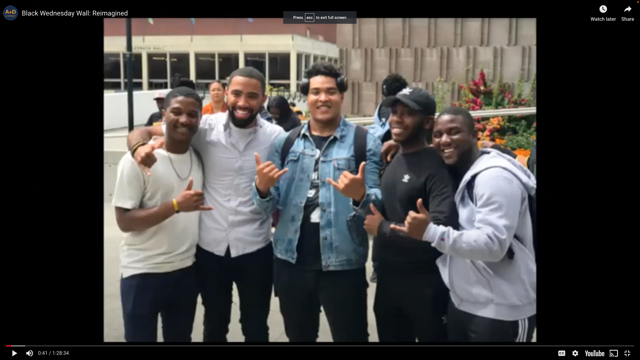 5 Black male students smiling outside of Golden Bear Cafe 