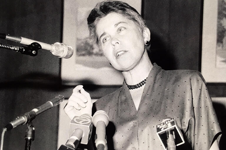 Christ speaking to reporters at a UC Berkeley press conference in 1993.