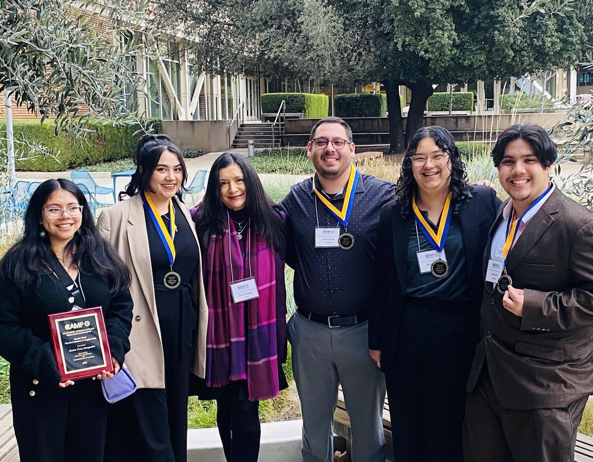 Diana celebrates with Cal NERDS research scholars for their research presentation recognition at a UC STEM statewide conference hosted by UC Riverside