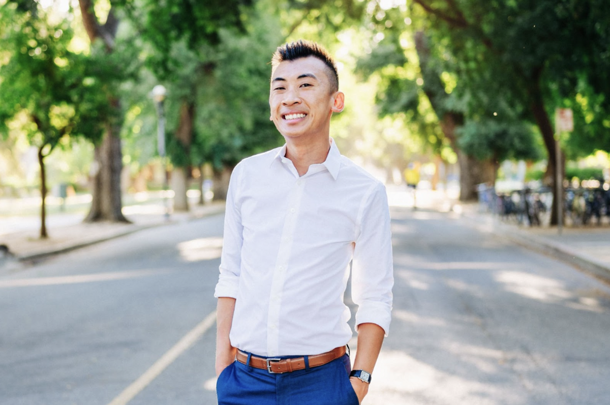Headshot of Peter Lê wearing a white button up shirt and navy blue pants.