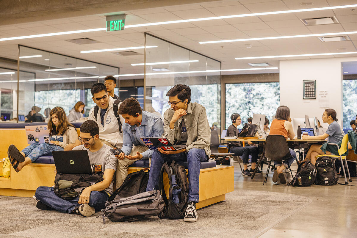 Group of male students studying together in Moffitt Library