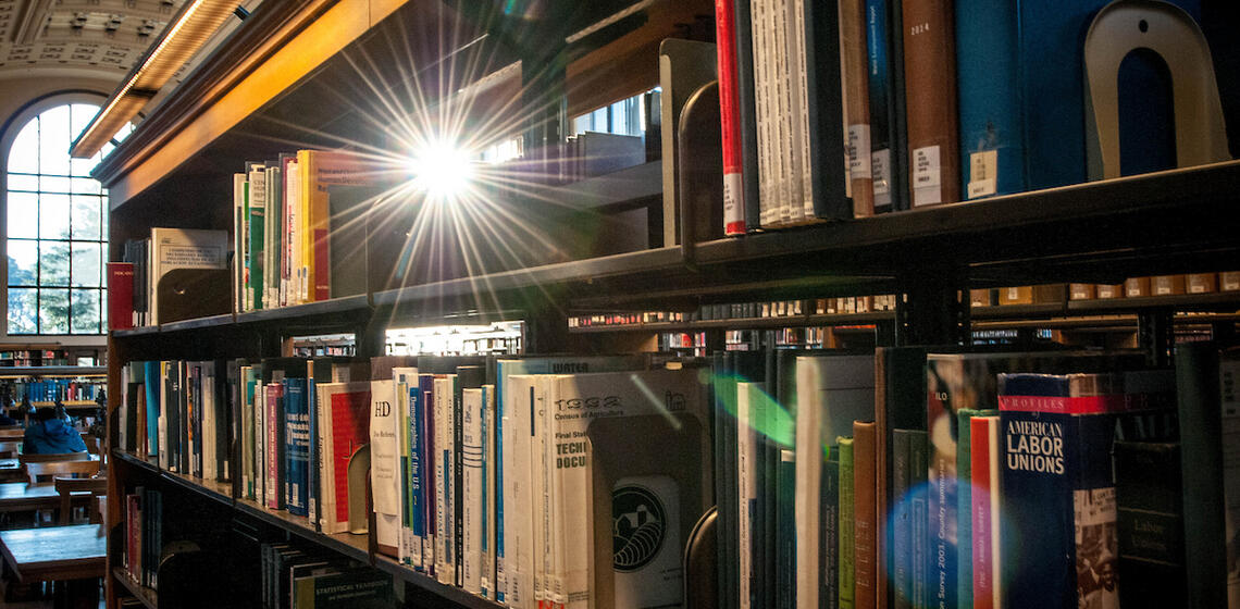 books on a shelf in Doe Library