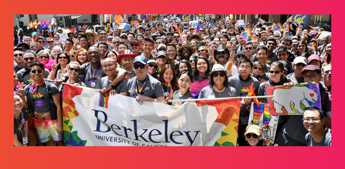 Group of people in pride attire posing with Berkeley banner
