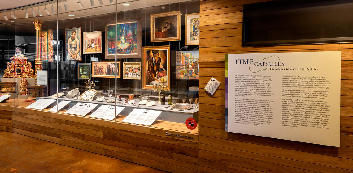 Museum exhibit with plaque reading "Time Capsules"