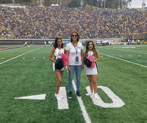 Takiyah Jackson, director of the African American Student Development program was honored by the Faculty Club for her work supporting Black student-athletes and Cal Athletics. Here she is pictured on the field of the stadium as she received the honor.