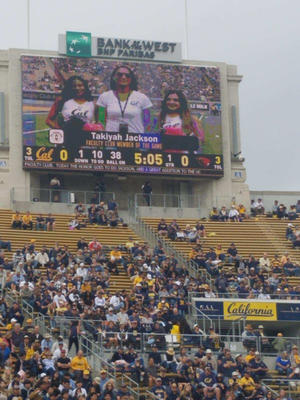 Takiyah Jackson, director of the African American Student Development program is honored by the Faculty Club for her work with Black student-athletes and Cal Athletics. Here she is seen on the jumbotron of the stadium as she received the award.